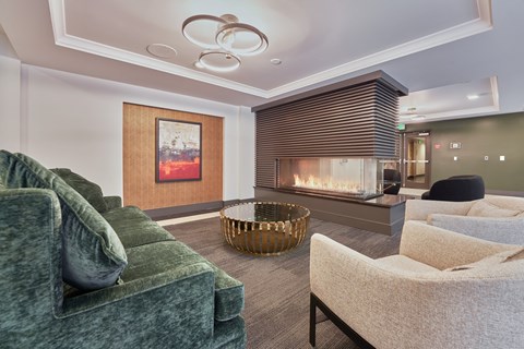 a living room with couches and a fireplace